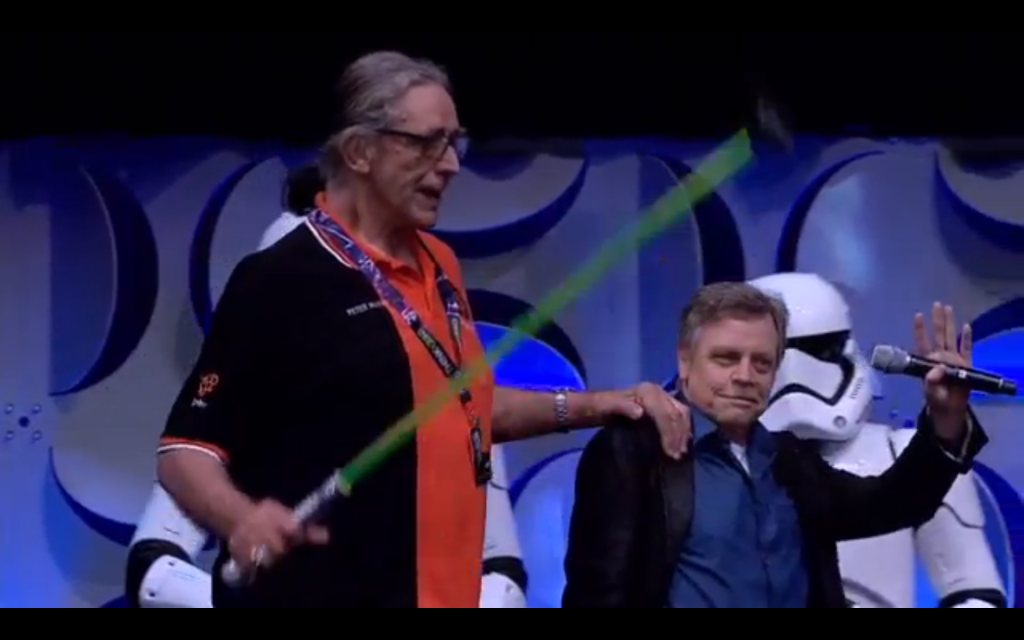 Peter Mayhew (Chewbacca) hobbles onstage with a lightsaber cane!